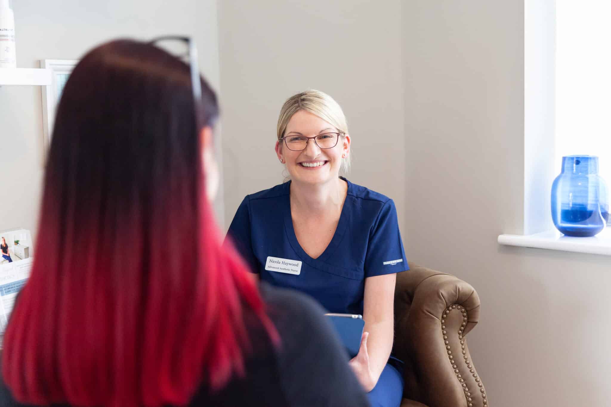 Nurse prescriber giving a one-to-one aesthetic consultation at a nurse-led clinic in Wakefield