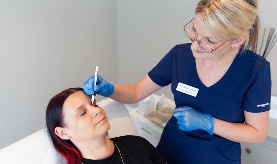 Nicola Haywood marking injection points during an anti wrinkle treatment consultation in her Wakefield clinic