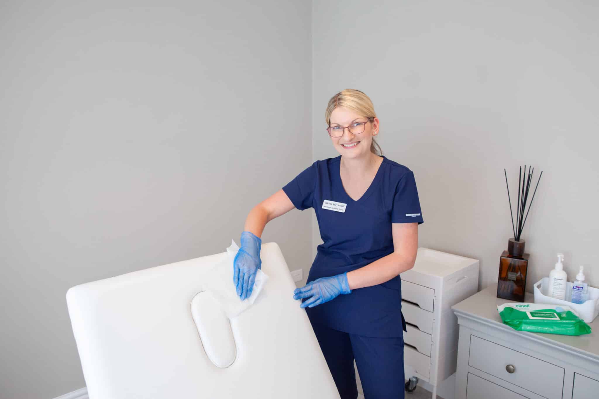 Nicola Haywood preparing a treatment room in her Wakefield clinic
