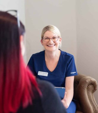 Nurse prescriber giving a one-to-one aesthetic consultation at a nurse-led clinic in Wakefield